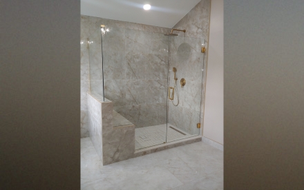 Elegant notched glass panel with gold hinges